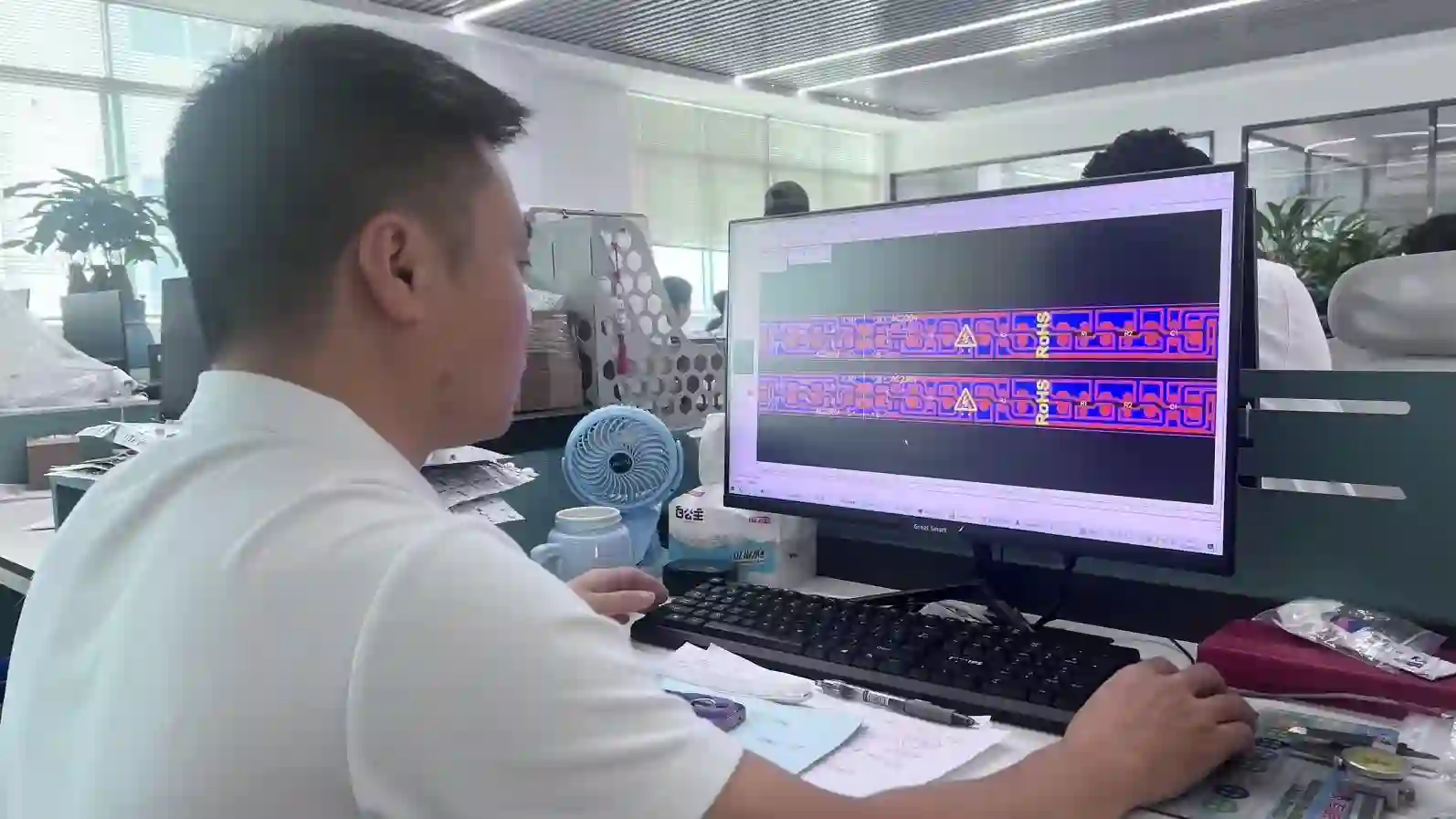 Engineer designing a custom LED strip circuit layout