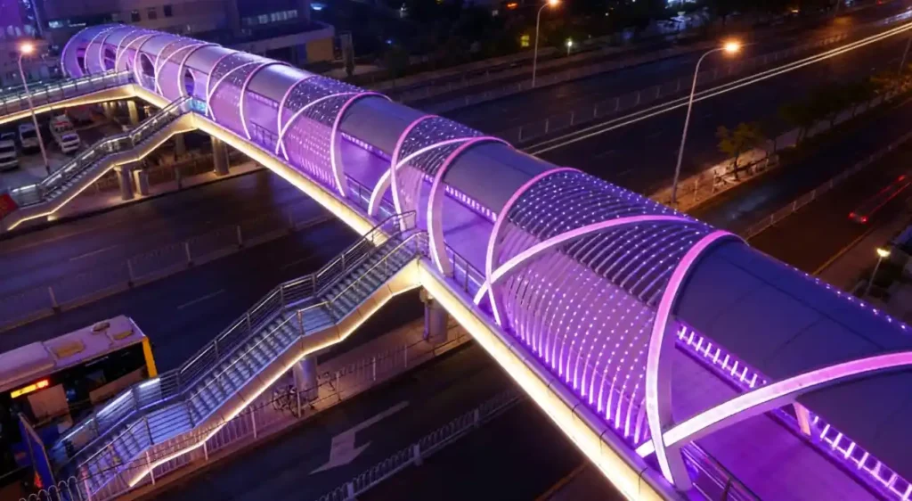 Aerial night view of RGB addressable neon flex pedestrian bridge in Riyadh