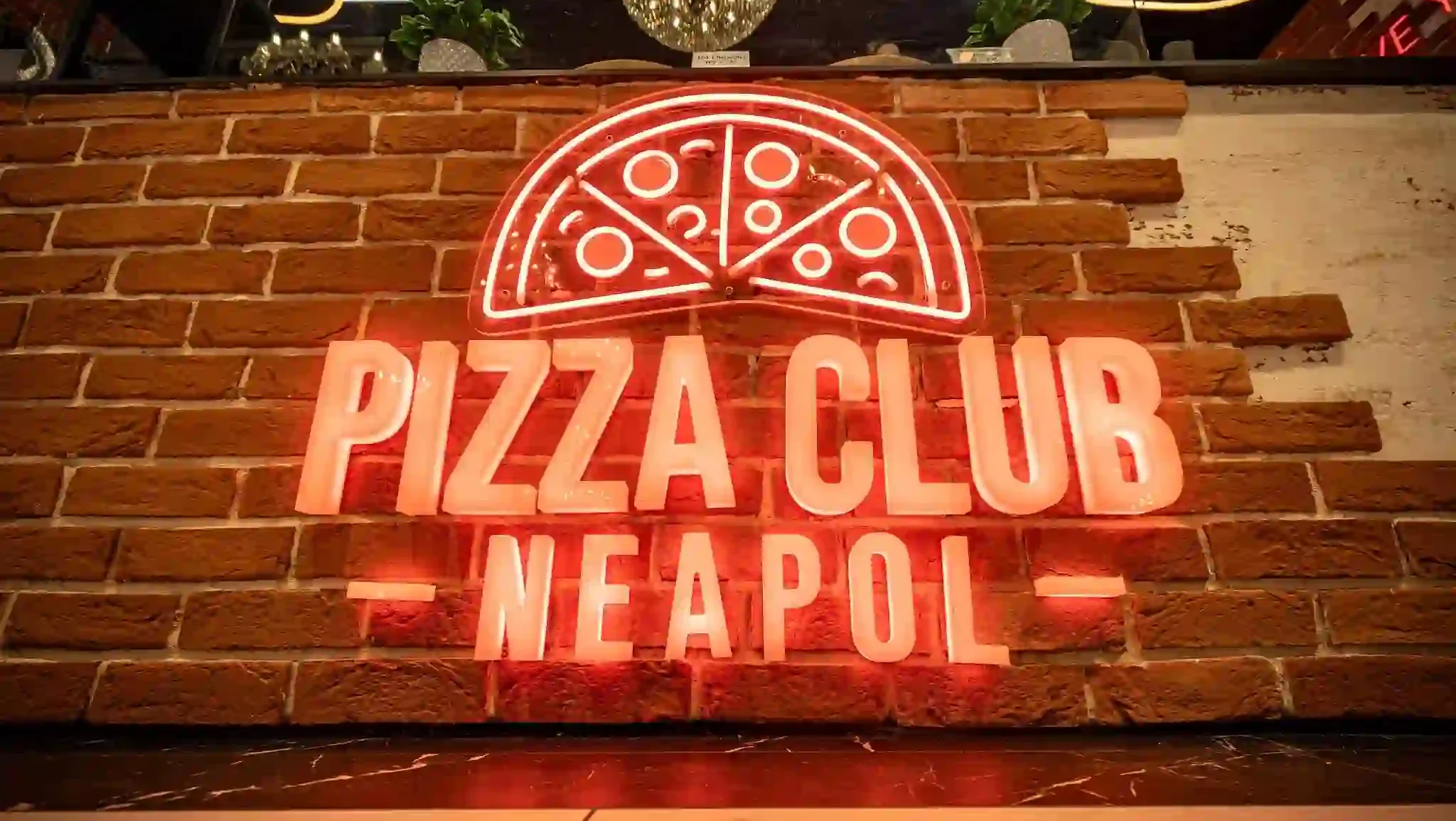 Coral red neon flex LED restaurant signage Pizza Club Neapol logo on brick wall