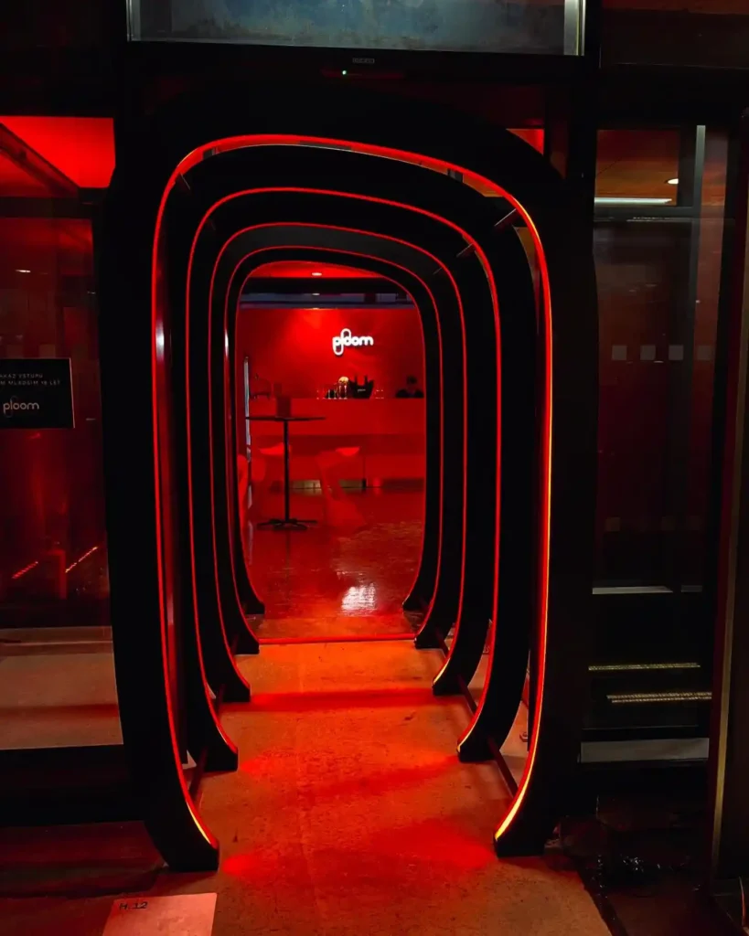 Top-bend red neon flex LED arch close-up at Ploom Roppongi pop-up