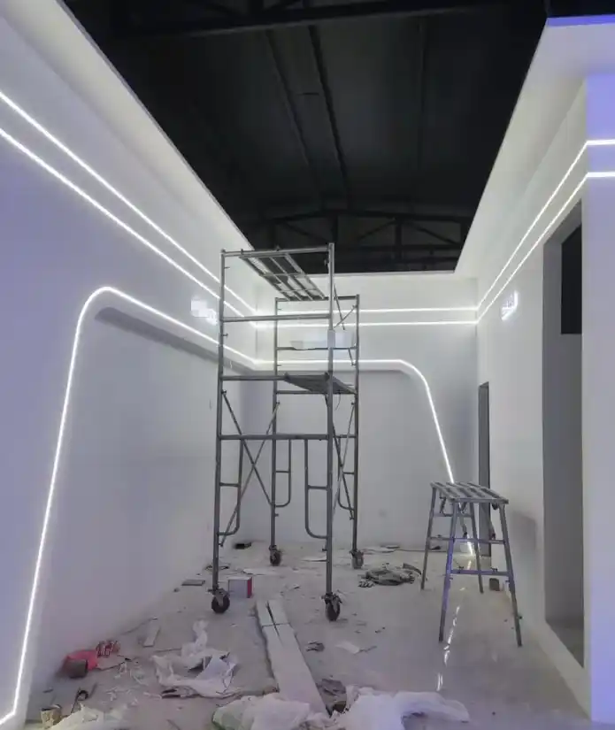 Retail kiosk lighting warm white cove on hospitality-branded mall booth in Bangkok