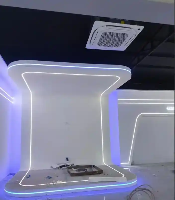 Retail kiosk lighting cantilever counter with continuous blue rim accent