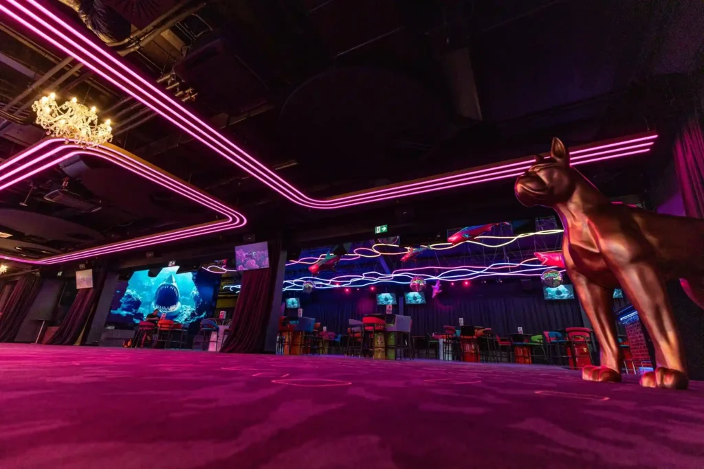 Bright green RGB neon flex ceiling scene across Prague event hall main floor