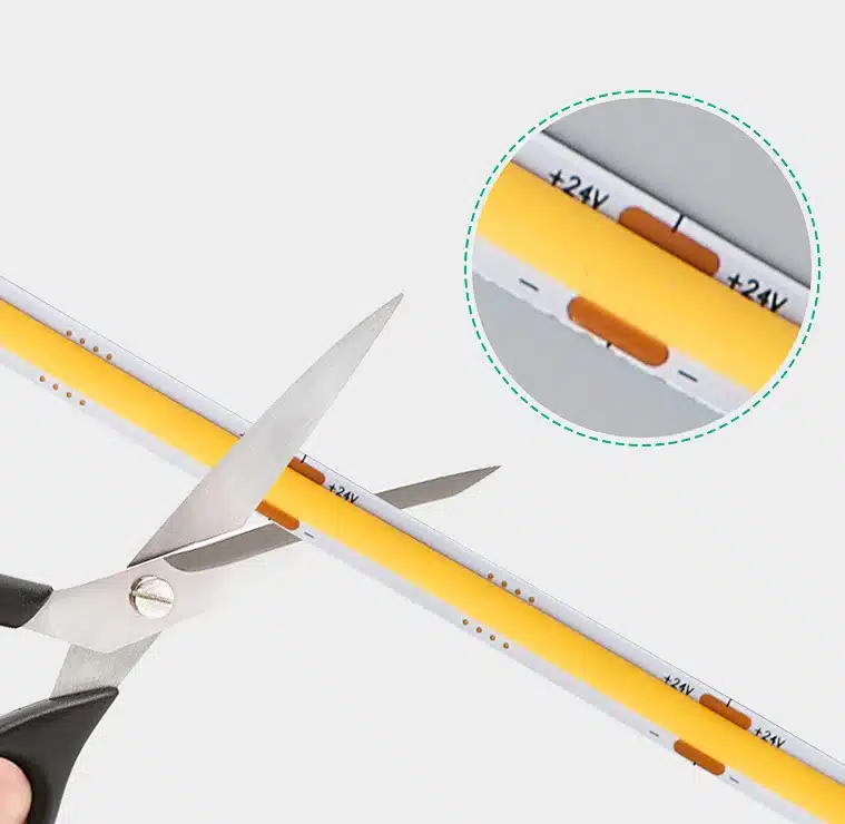 Cuttable COB LED strip close-up showing copper pads and cut marks
