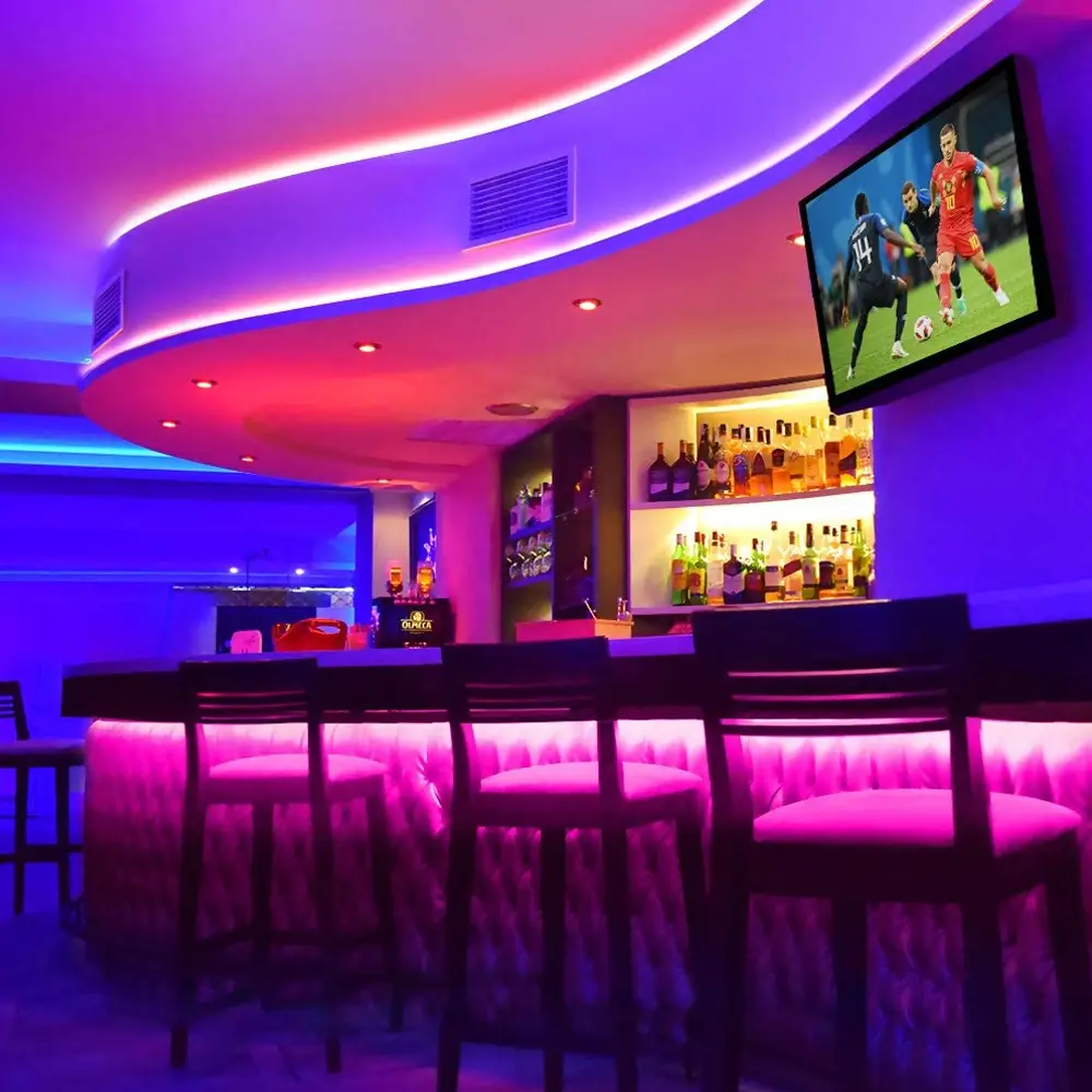 Dinner-service amber scene lit by an RGB COB LED strip restaurant lighting installation in an Antwerp bar