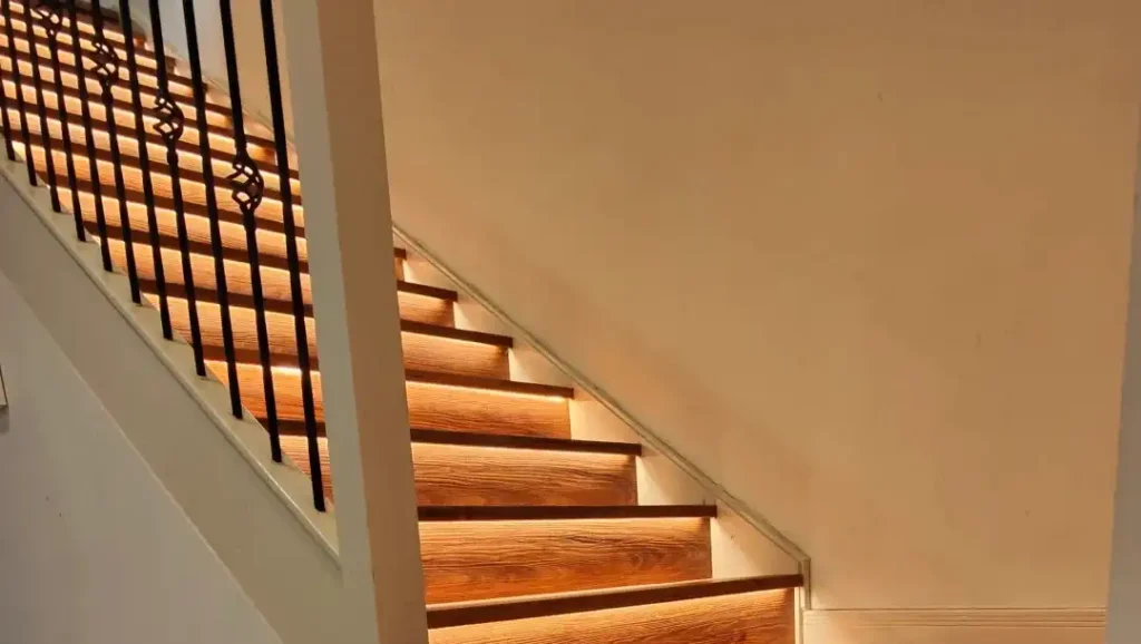 12V constant-voltage LED driver stack in a basement plant room feeding a three-storey stair lighting system